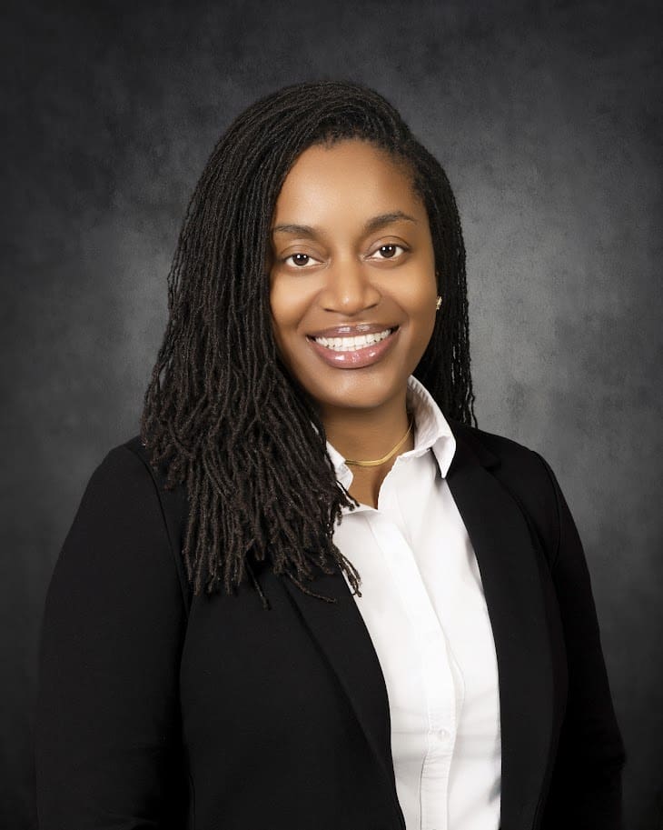 Smiling professional headshot person in blazer