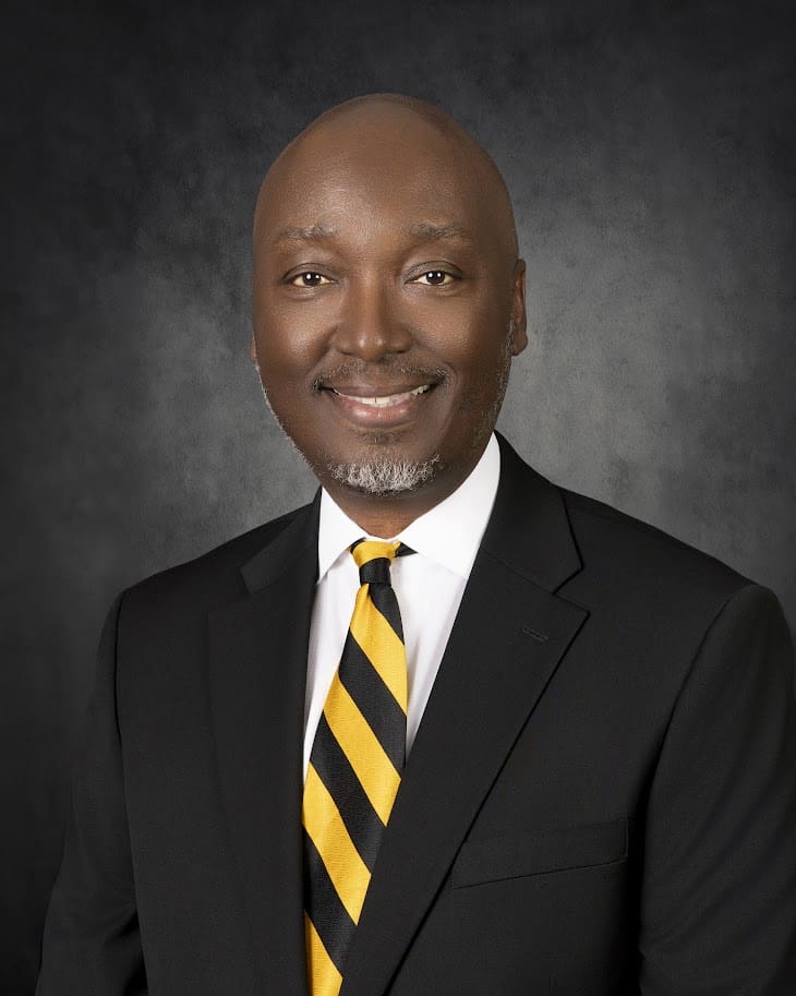 Smiling professional in suit with striped tie