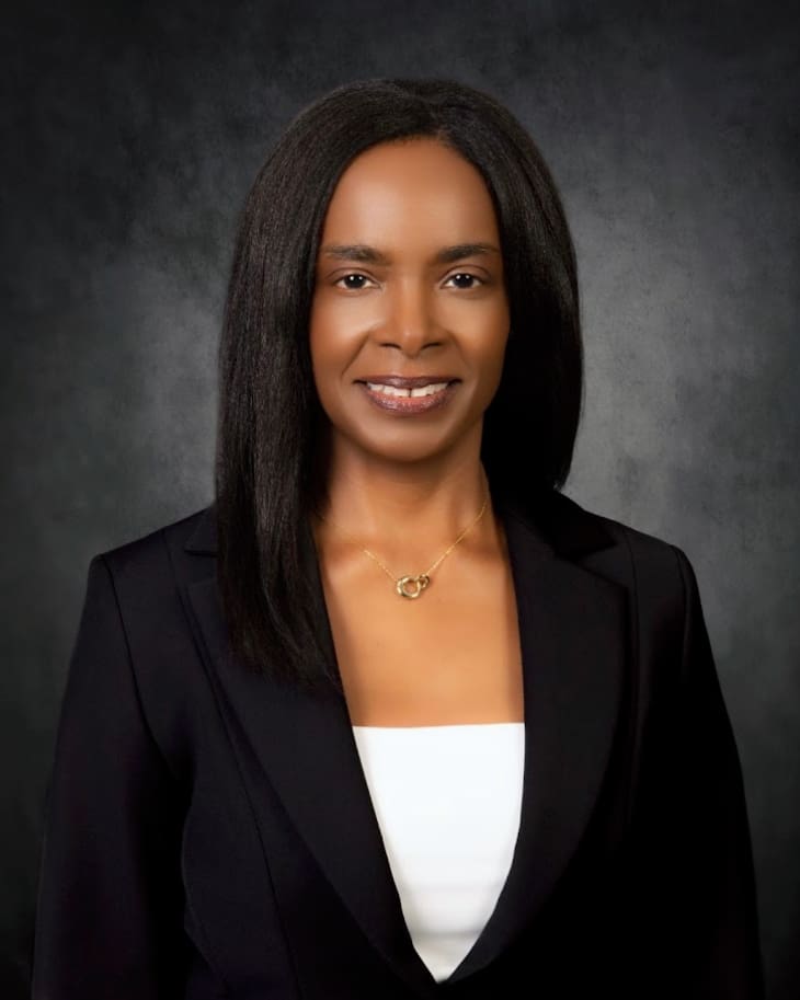 Professional woman smiling in black blazer