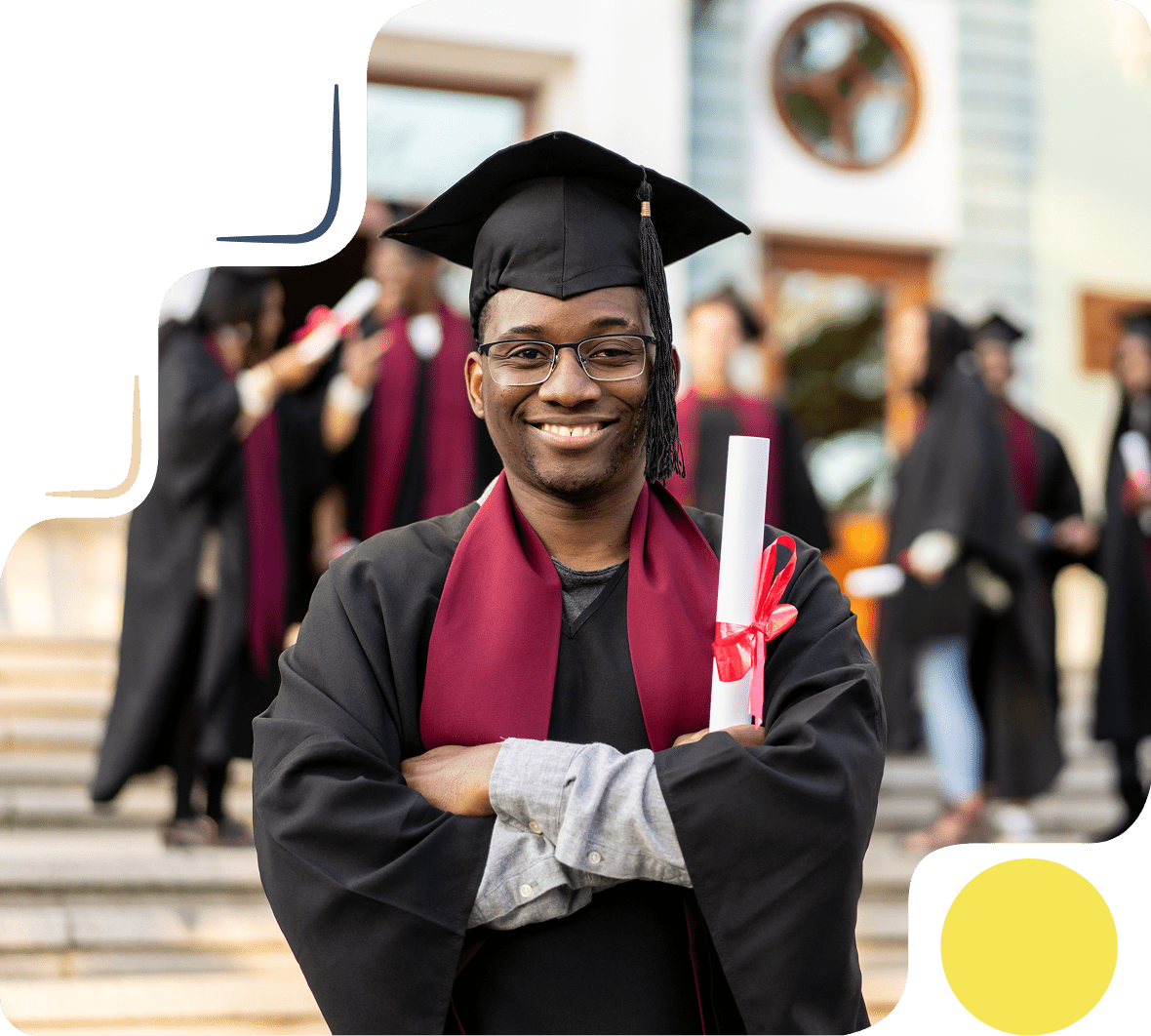 Smiling graduate in cap and gown holding diploma